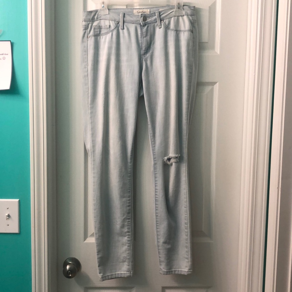 Jessica Simpson washed out ripped jeans